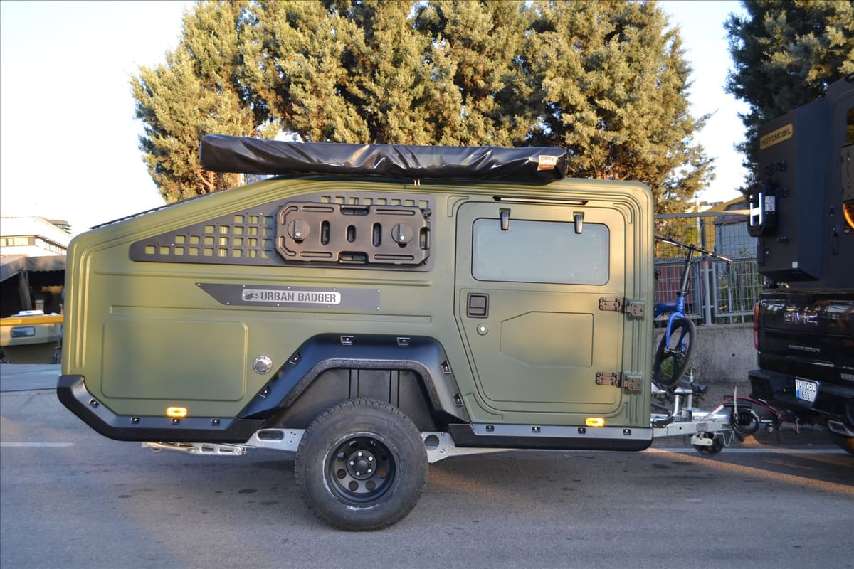 Urban Badger Towable Caravan, side view with roof awning and bike carrier